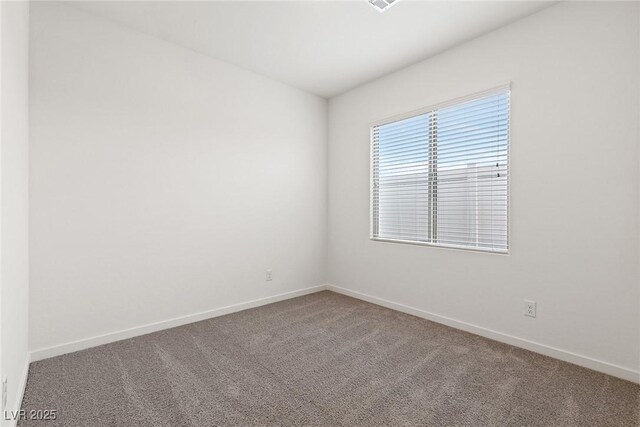 2733 Avril Point St, Las Vegas, NV 89156 - spare room featuring baseboards and carpet