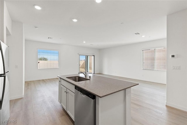 2733 Avril Point St, Las Vegas, NV 89156 - kitchen with a sink, appliances with stainless steel finishes, light wood-style floors, and open floor plan