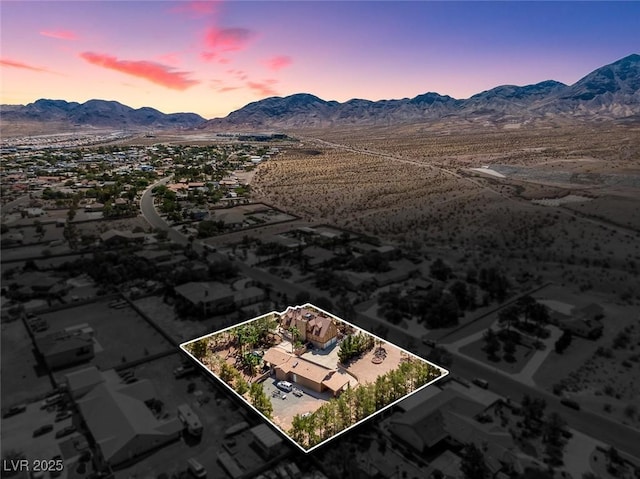 bird's eye view with a mountain view and a desert view
