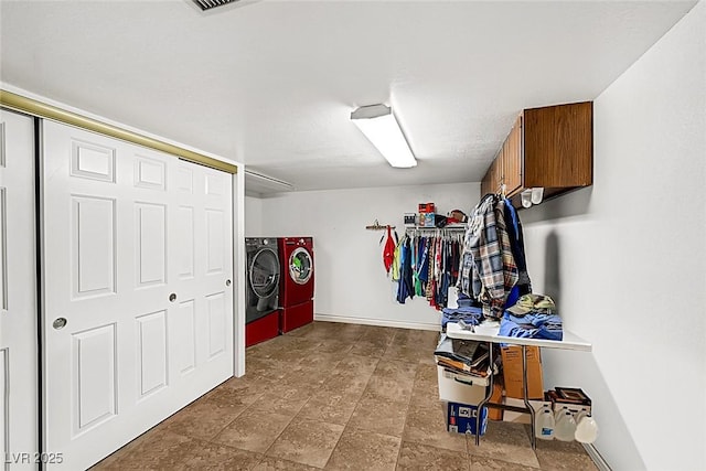 interior space featuring baseboards and washer and dryer