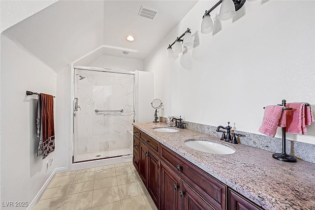 full bathroom with visible vents, a marble finish shower, a sink, and lofted ceiling