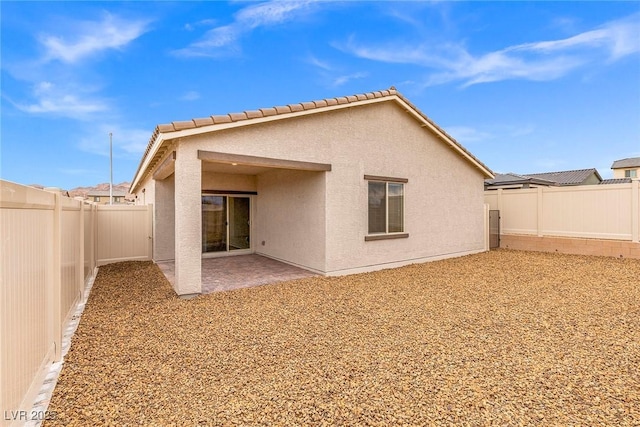 2739 Avril Point St, Las Vegas, NV 89156 - back of house with stucco siding, a fenced backyard, and a patio