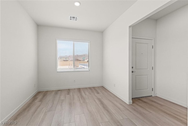 2739 Avril Point St, Las Vegas, NV 89156 - empty room featuring light wood-style floors, visible vents, and baseboards