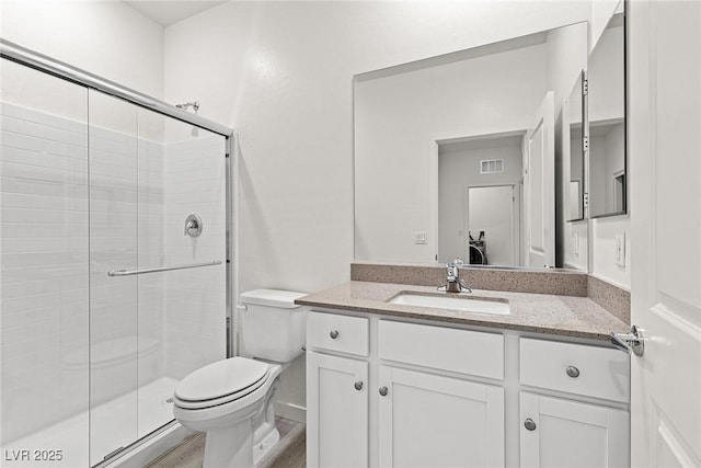2739 Avril Point St, Las Vegas, NV 89156 - bathroom with vanity, toilet, a shower stall, and visible vents