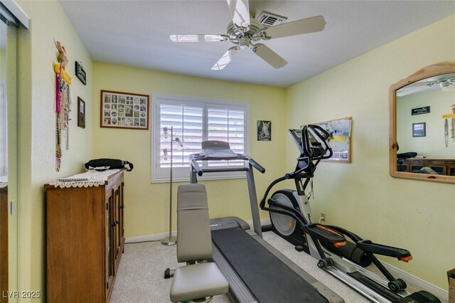 workout room with ceiling fan, visible vents, light carpet, and baseboards