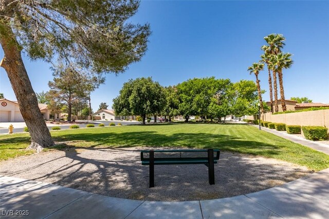 view of home's community featuring a yard and a residential view