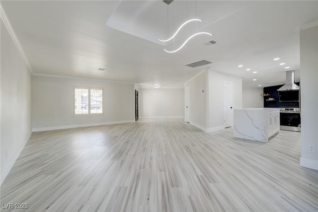 unfurnished living room featuring visible vents, baseboards, and an inviting chandelier