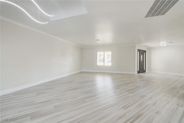 unfurnished living room with visible vents, light wood-style floors, crown molding, and baseboards