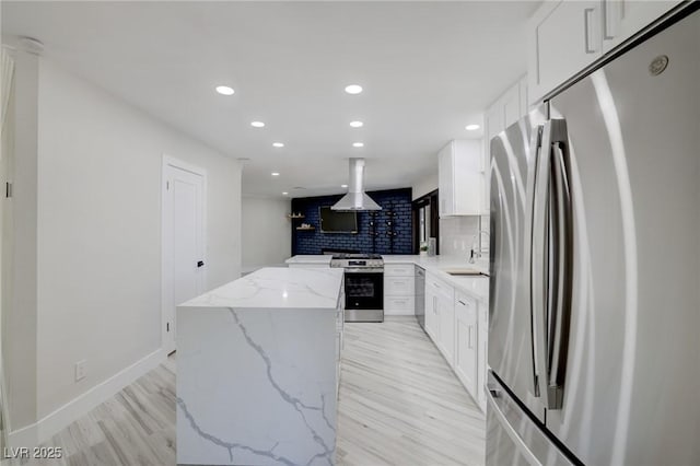 kitchen featuring island range hood, a center island, recessed lighting, appliances with stainless steel finishes, and backsplash