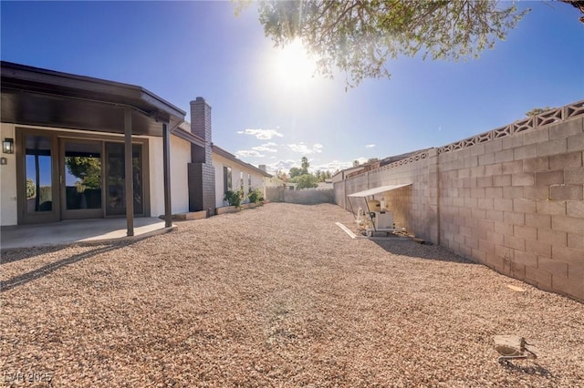 view of yard with a patio and a fenced backyard