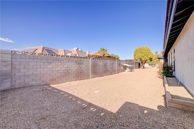 view of yard with a fenced backyard