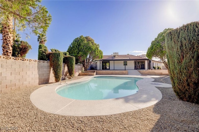 view of swimming pool with a fenced in pool and a fenced backyard
