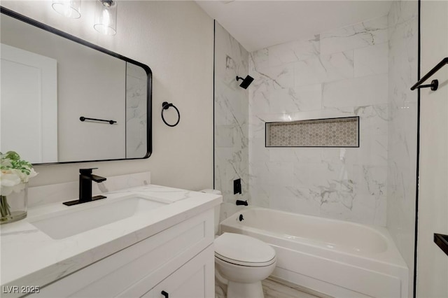 bathroom with vanity, toilet, and bathtub / shower combination