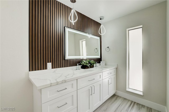 4454 Harmony Ct, Las Vegas, NV 89121 - full bath with double vanity, baseboards, and wood finished floors
