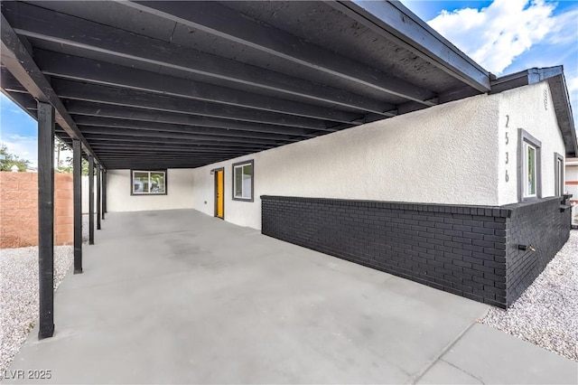 view of patio featuring an attached carport