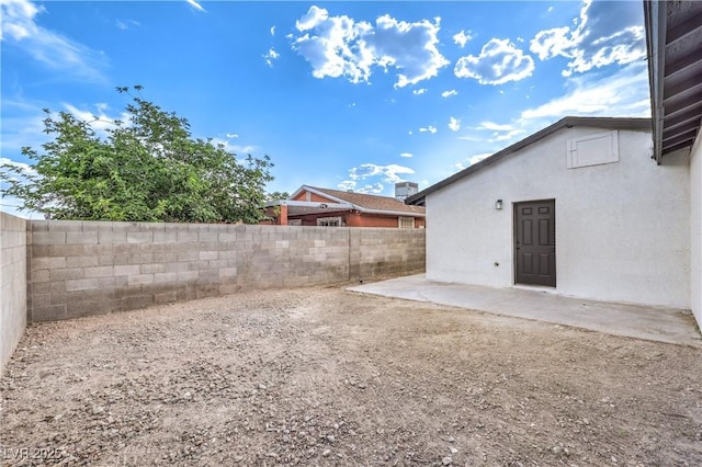 view of yard featuring a patio and a fenced backyard