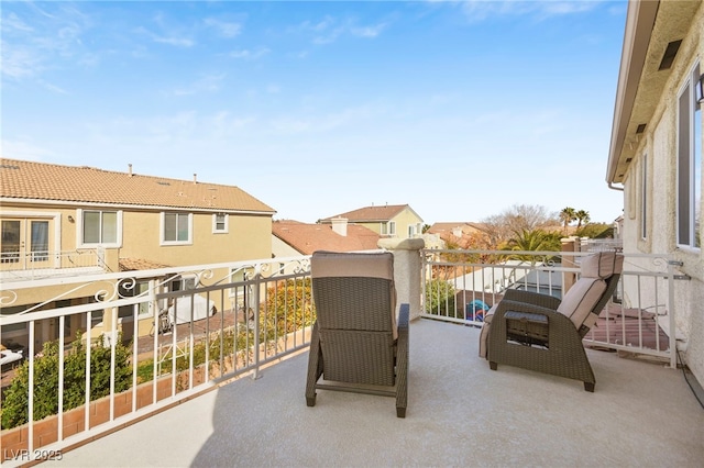balcony featuring french doors and a residential view