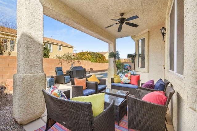 view of patio / terrace with an outdoor living space, a fenced backyard, ceiling fan, and grilling area