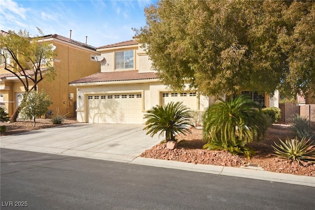 view of front facade featuring a garage, stucco siding, driveway, and a tiled roof