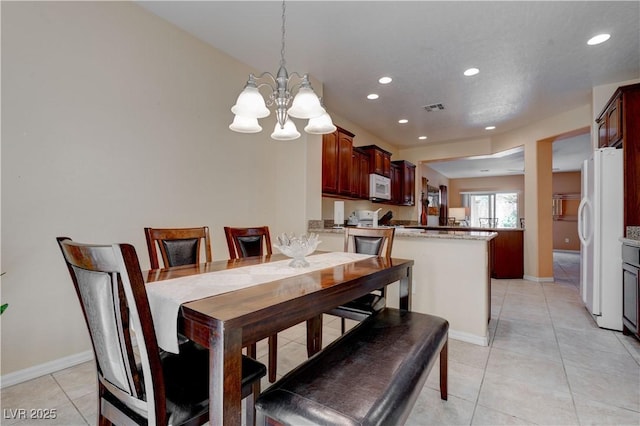dining space featuring recessed lighting, a notable chandelier, light tile patterned flooring, and visible vents