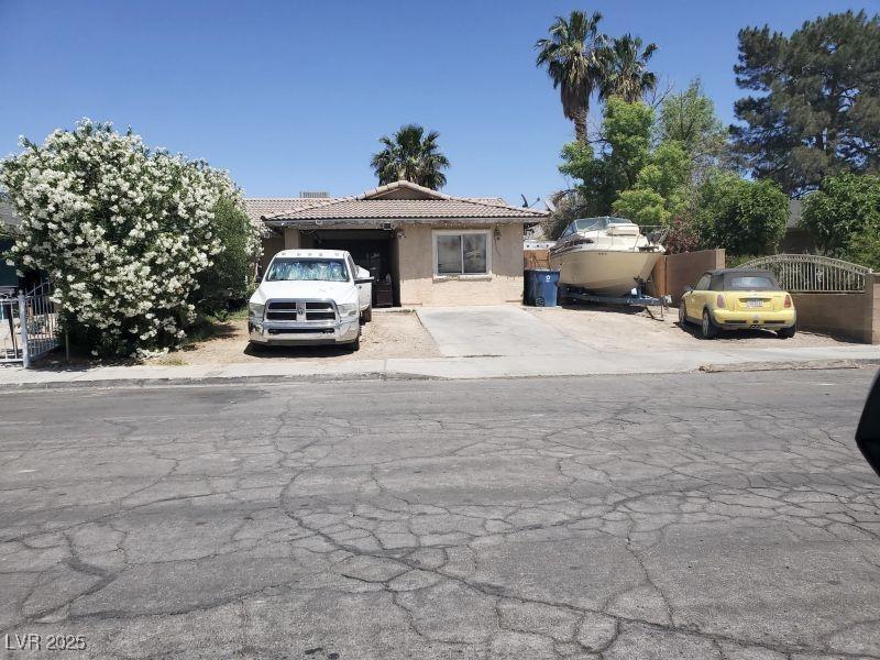 view of front of property with stucco siding and a tile roof