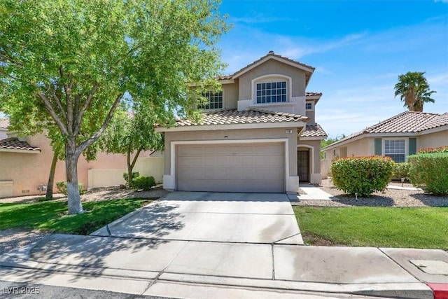 1861 Windward Ct, Henderson, NV 89012 - mediterranean / spanish-style home featuring an attached garage, stucco siding, concrete driveway, and a tile roof