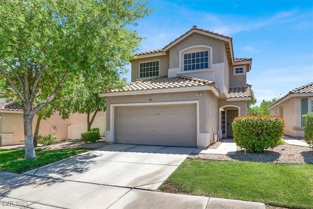 1861 Windward Ct, Henderson, NV 89012 - mediterranean / spanish-style home featuring stucco siding, an attached garage, driveway, and a tiled roof