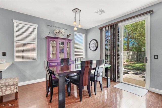 1861 Windward Ct, Henderson, NV 89012 - dining room with light wood-style floors, baseboards, and visible vents