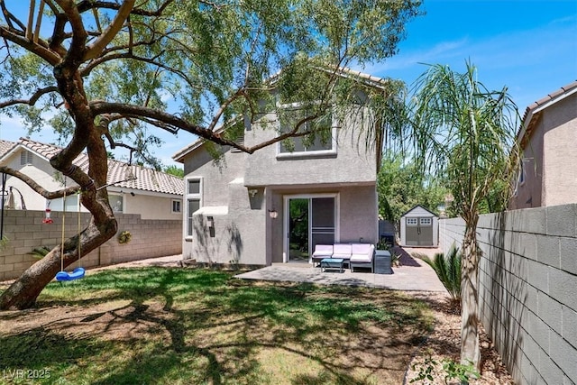 1861 Windward Ct, Henderson, NV 89012 - back of house featuring stucco siding, a fenced backyard, outdoor lounge area, and a shed