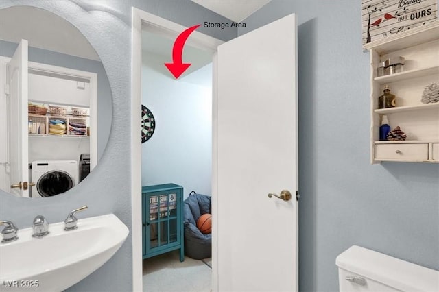 1861 Windward Ct, Henderson, NV 89012 - half bath featuring a sink, washer / dryer, and toilet