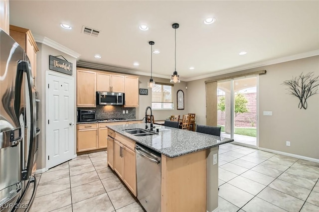 kitchen with appliances with stainless steel finishes, a sink, light brown cabinets, light tile patterned floors, and ornamental molding