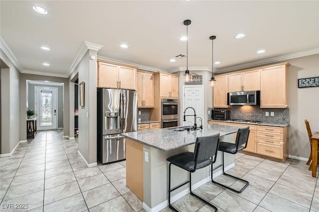 kitchen featuring appliances with stainless steel finishes, light brown cabinets, a sink, crown molding, and backsplash