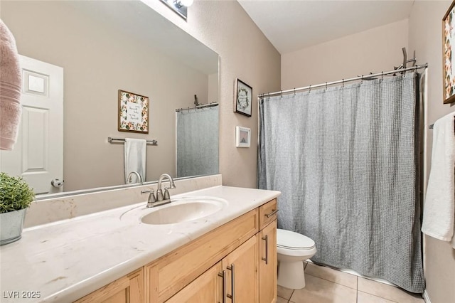 bathroom featuring tile patterned floors, toilet, vanity, and curtained shower