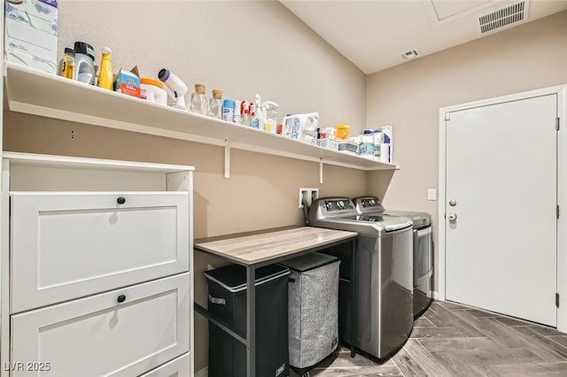 7497 Alamo Ranch Ave, Las Vegas, NV 89179 - laundry room with washing machine and clothes dryer and cabinet space