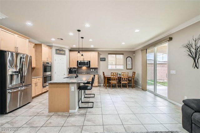 kitchen featuring stainless steel appliances, ornamental molding, light tile patterned flooring, backsplash, and a breakfast bar