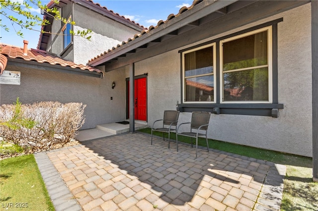 5361 Cabrito Dr, Las Vegas, NV 89103 - entrance to property with stucco siding, a patio area, and a tile roof