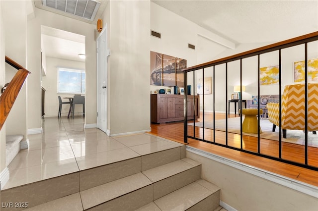 5361 Cabrito Dr, Las Vegas, NV 89103 - stairway with baseboards, tile patterned flooring, and visible vents