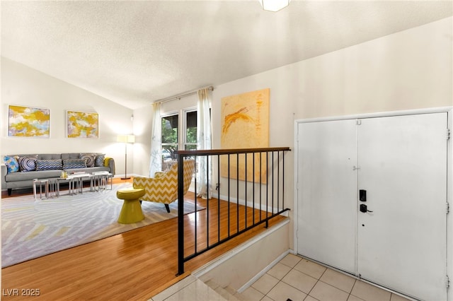 5361 Cabrito Dr, Las Vegas, NV 89103 - foyer with a textured ceiling, vaulted ceiling, and tile patterned floors