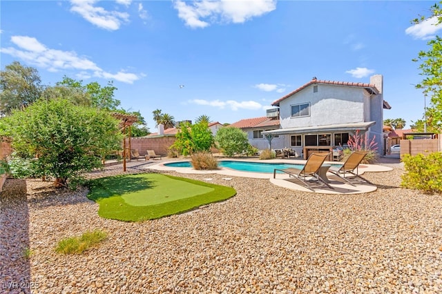 5361 Cabrito Dr, Las Vegas, NV 89103 - view of swimming pool featuring a fenced in pool, a fenced backyard, and a patio area