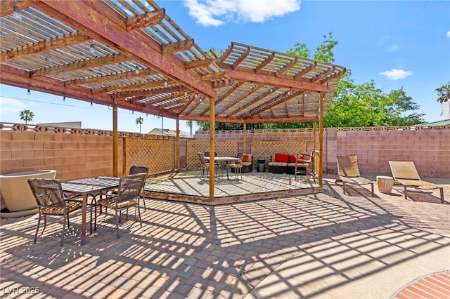 5361 Cabrito Dr, Las Vegas, NV 89103 - view of patio featuring outdoor dining area, fence, and a pergola