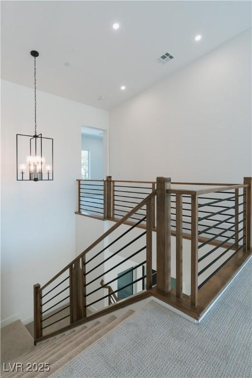 8721 Robinson Ridge Dr, Las Vegas, NV 89117 - staircase featuring a chandelier and recessed lighting