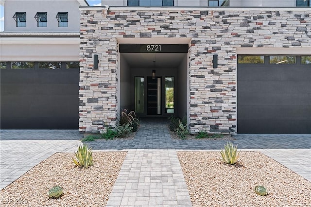 8721 Robinson Ridge Dr, Las Vegas, NV 89117 - entrance to property with stone siding and a garage