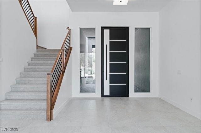 8721 Robinson Ridge Dr, Las Vegas, NV 89117 - entryway featuring stairs and light tile patterned floors