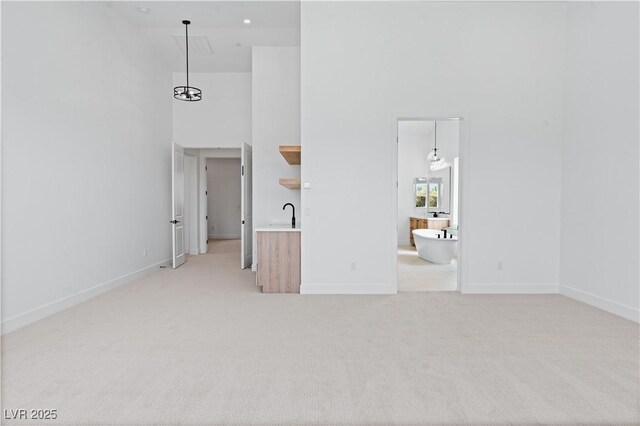 8721 Robinson Ridge Dr, Las Vegas, NV 89117 - spare room with a high ceiling and light colored carpet