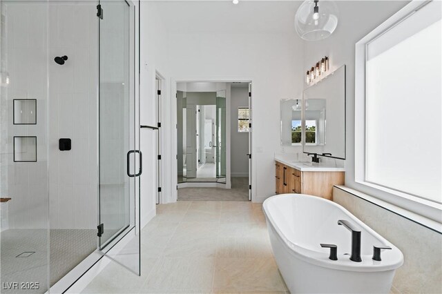 8721 Robinson Ridge Dr, Las Vegas, NV 89117 - bathroom featuring a shower stall, vanity, and a freestanding bath