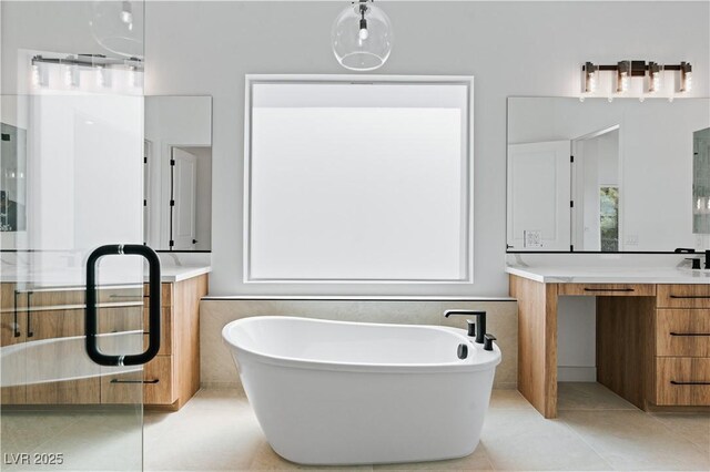 8721 Robinson Ridge Dr, Las Vegas, NV 89117 - full bath with a soaking tub, vanity, and tile patterned flooring