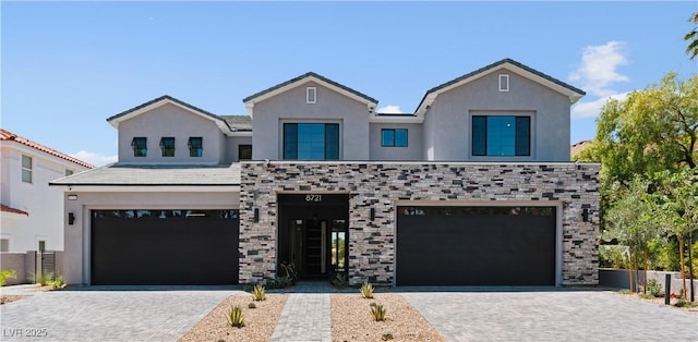 8721 Robinson Ridge Dr, Las Vegas, NV 89117 - view of front of home with an attached garage, decorative driveway, and stucco siding
