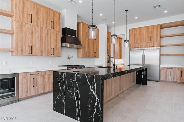 8721 Robinson Ridge Dr, Las Vegas, NV 89117 - kitchen with open shelves, stainless steel built in fridge, wall chimney range hood, modern cabinets, and recessed lighting