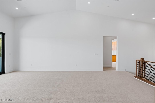 8721 Robinson Ridge Dr, Las Vegas, NV 89117 - unfurnished room featuring light carpet, lofted ceiling, and recessed lighting