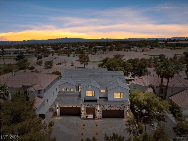 8721 Robinson Ridge Dr, Las Vegas, NV 89117 - view of front facade with a garage, driveway, stucco siding, a mountain view, and a residential view
